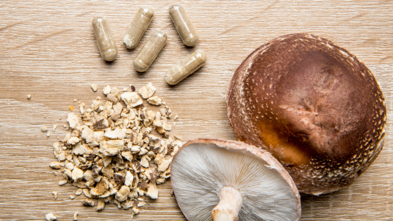 Dried mushroom pieces next to finished capsules show why raw powder texture matters