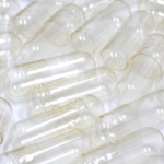 Close-up of empty gelatin capsules used for supplement filling