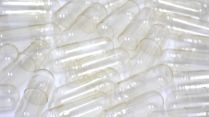Close-up of empty gelatin capsules used for supplement filling