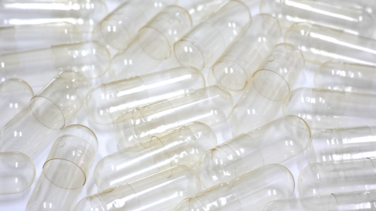 Close-up of empty gelatin capsules used for supplement filling